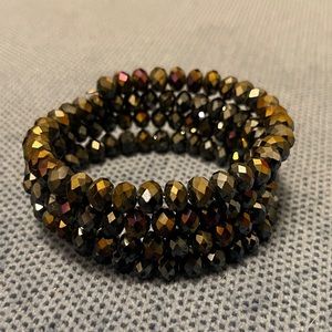 Dark shimmery spiral beaded bracelet, easy wrap on and off, very shiny.